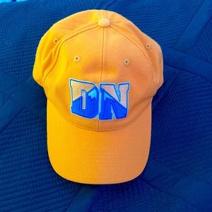 A yellow Denver nuggets NBA hat with the logo on the front.